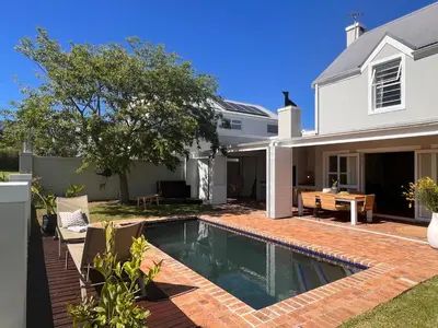 a swimming pool in the backyard of a house at House on Charme in Stellenbosch