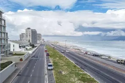 a view of a city street with the ocean at Ocean View C403 by CTHA in Bloubergstrand