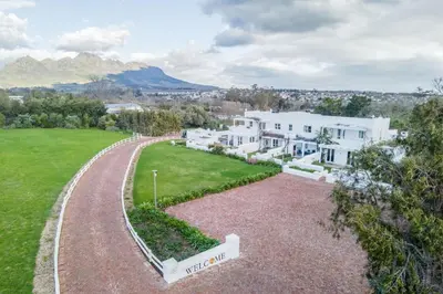 an aerial view of a house with a driveway at Sunset Farm Stellenbosch in Stellenbosch