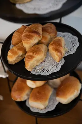 two plates of croissants are sitting on a table at Macaron Boutique Guest House in Franschhoek