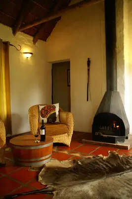 a living room with a couch and a fireplace at Mooi Bly in Paarl