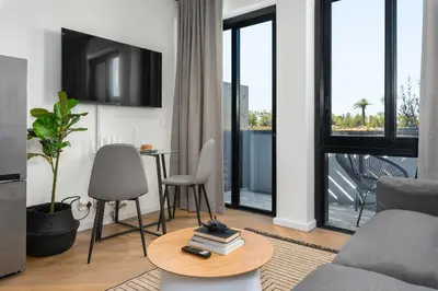 a living room with a couch and a table at Bridgewater One Apartments in Cape Town