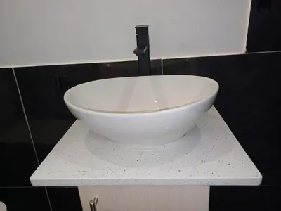 a white bowl sitting on top of a counter at Ojong's Court Bellville in Cape Town