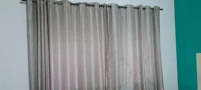 a shower curtain in a room with a green wall at Ojong's Court Bellville in Cape Town