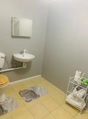 a bathroom with a sink and a toilet at SpaciousNetflix#Wifi#Parking#CentralWinefarms#Mall in Cape Town