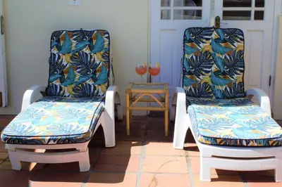 two chairs sitting next to each other in a room at Mafunyani Cottage in Franschhoek