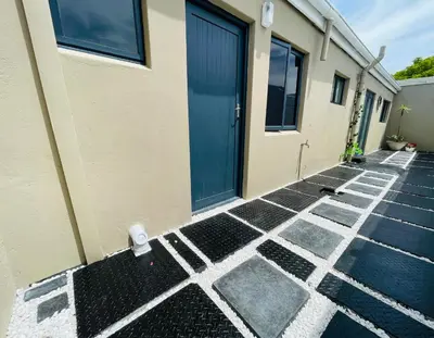 a door to a building with black and white tiles at Sixth Avenue Residence Halaal Accommodation Cape Town in Cape Town