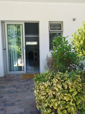 a front door of a house with a plant at Oak Village in Stellenbosch