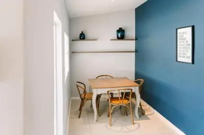 a dining room with a table and chairs at The Salene Hotel & Apartments in Stellenbosch