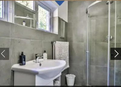 a bathroom with a sink and a shower at In die Hoekie in Hermanus