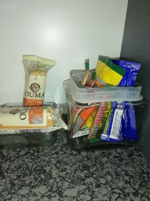 two plastic containers of food and snacks on a counter at Glenley place in Hermanus