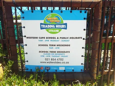 a sign for a training hours stand at a park at Palmsbeach 3 in Strand