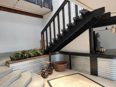 a staircase in a house with plants on it at Hornbill House Self Catering Accommodation in Hermanus