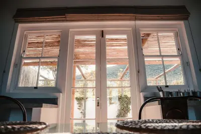 a door with two windows in a room at Penhill Farm West Grange in Nuy