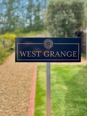 a sign for the west driveway of a house at Penhill Farm West Grange in Nuy