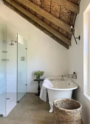 a bathroom with a tub and a glass shower at Penhill Farm East Grange in Nuy