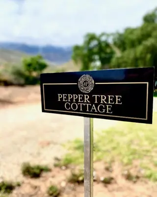a sign that reads pepper tree cottage at Penhill Farm Peppertree Cottage in Nuy