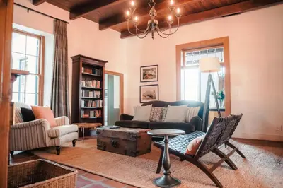a living room with a couch and a table at Penhill Farm The Manor House in Nuy