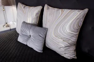 two pillows sitting on top of a bed at MLMK Property 17 in Cape Town
