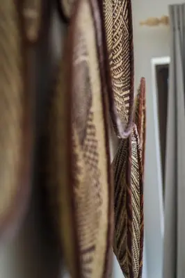 a group of purses hanging on a wall at Villa Nordica - 2 bedroom self-catering apartment in Cape Town