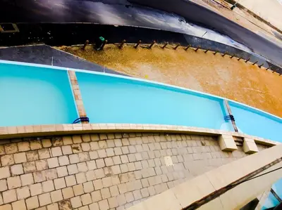 an overhead view of a swimming pool on a building at Beautiful Ocean View Apartment in Cape Town