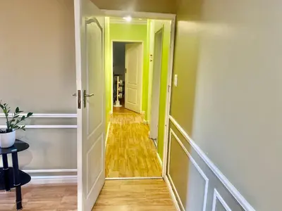 a hallway with a mirror in a room at Beautiful apartment in century city in Cape Town