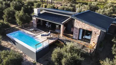 an overhead view of a house with a swimming pool at Bains View Olive and Guest Farm in Wellington
