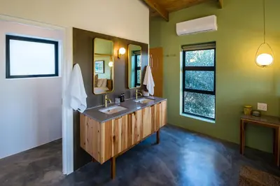 a bathroom with a sink and a mirror at Bains View Olive and Guest Farm in Wellington