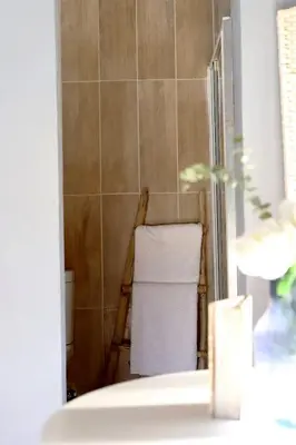 a bathroom with a towel rack and a sink at House of Perez in Wellington