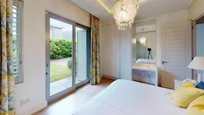 a bedroom with a bed and a large window at Stamford on Sea by Top Destinations Rentals in Hermanus