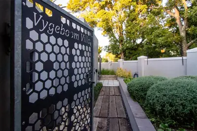 a gate in a fence with the words mychoimmy ninja on it at Vygeboom Villa/ Durbanville in Cape Town