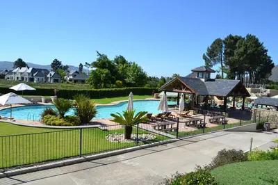 a swimming pool with a gazebo and a resort at Pearl Valley-Golf Safari SA in Paarl