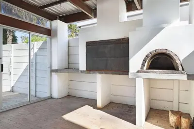 an outdoor pizza oven in a house at Prestigious Guest Villa in Cape Town
