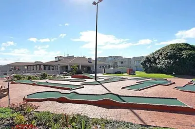 a park with a bunch of sculptures on the ground at Hermanus Beach Club 31 in Hermanus