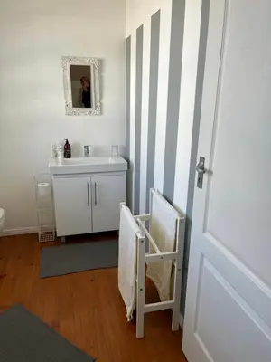 a bathroom with a sink and a mirror at Paradyskloof Suite in Stellenbosch
