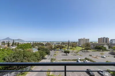 a view of a parking lot from a balcony at 2 Bedroom Secure Pool Strong WiFi in Cape Town