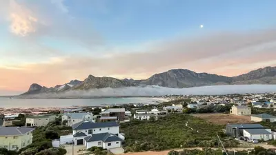 a view of a town with mountains in the background at The Butterfly Villa in Pringle Bay