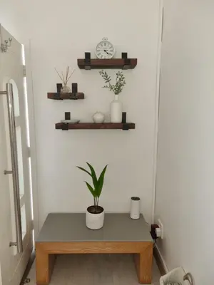 a table in a room with a plant on it at The Ridge in Cape Town