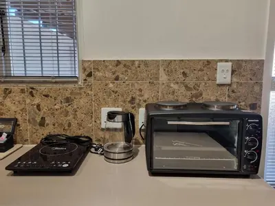 a toaster oven sitting on top of a kitchen counter at The Ridge in Cape Town