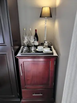 a table with wine glasses and a lamp on it at Perle Du Cap in Paarl