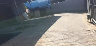 a brick sidewalk in front of a building at PEACE LODGE in Cape Town