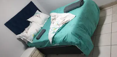 a couple of pillows on a bed in a room at PEACE LODGE in Cape Town