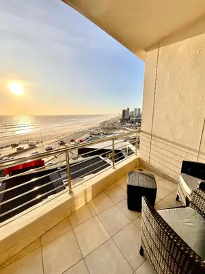 a balcony with a view of the beach at 502 Portico in Cape Town