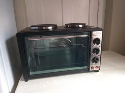 a black toaster oven sitting on top of a counter at Prince Alfreds in Caledon