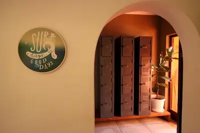 a room with a wall with a clock on the wall at Surfhostel Cape Town in Cape Town