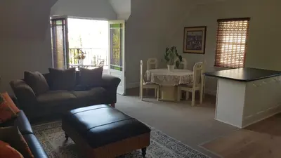 a living room with a couch and a table at Mountain View Self-Catering Apartments in Somerset West