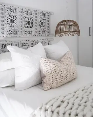 a white bed with white pillows and a lamp at Quiet hidden gem in historic Stellenbosch in Stellenbosch