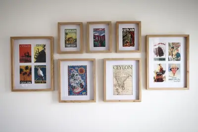 a group of framed pictures on a wall at Quiet hidden gem in historic Stellenbosch in Stellenbosch