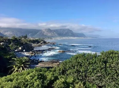 a view of the ocean with mountains in the distance at 2-Bedroom Hermanus - Sleeps 4 - Near Sea in Hermanus