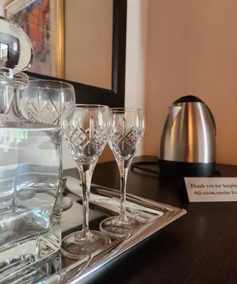 a group of wine glasses on a tray on a table at Traduire in Cape Town